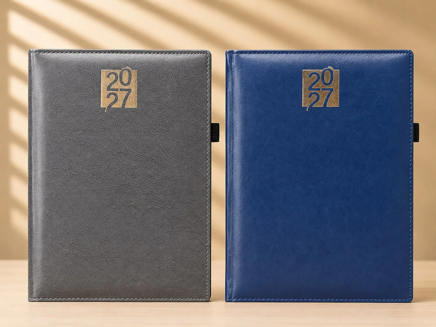Grey and navy diaries with a gold foil block